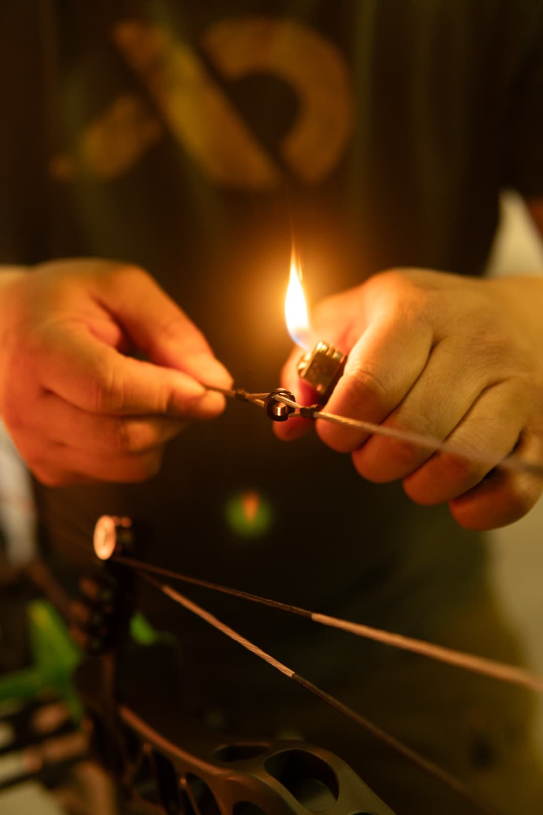 Burning off serving thread on a bow string